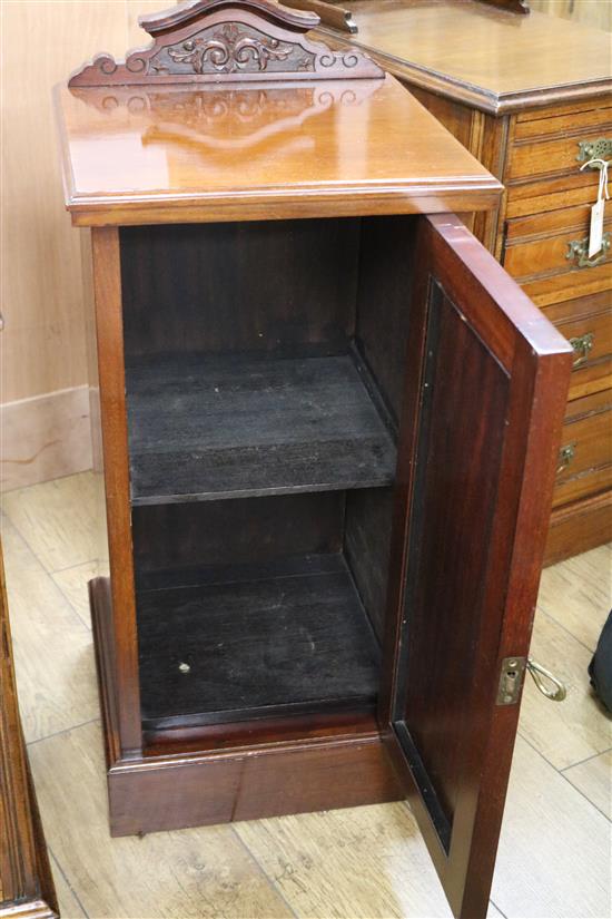 A pair of Victorian mahogany four-drawer pedestals (converted to bedside chests) and a pot cupboard W.40cm